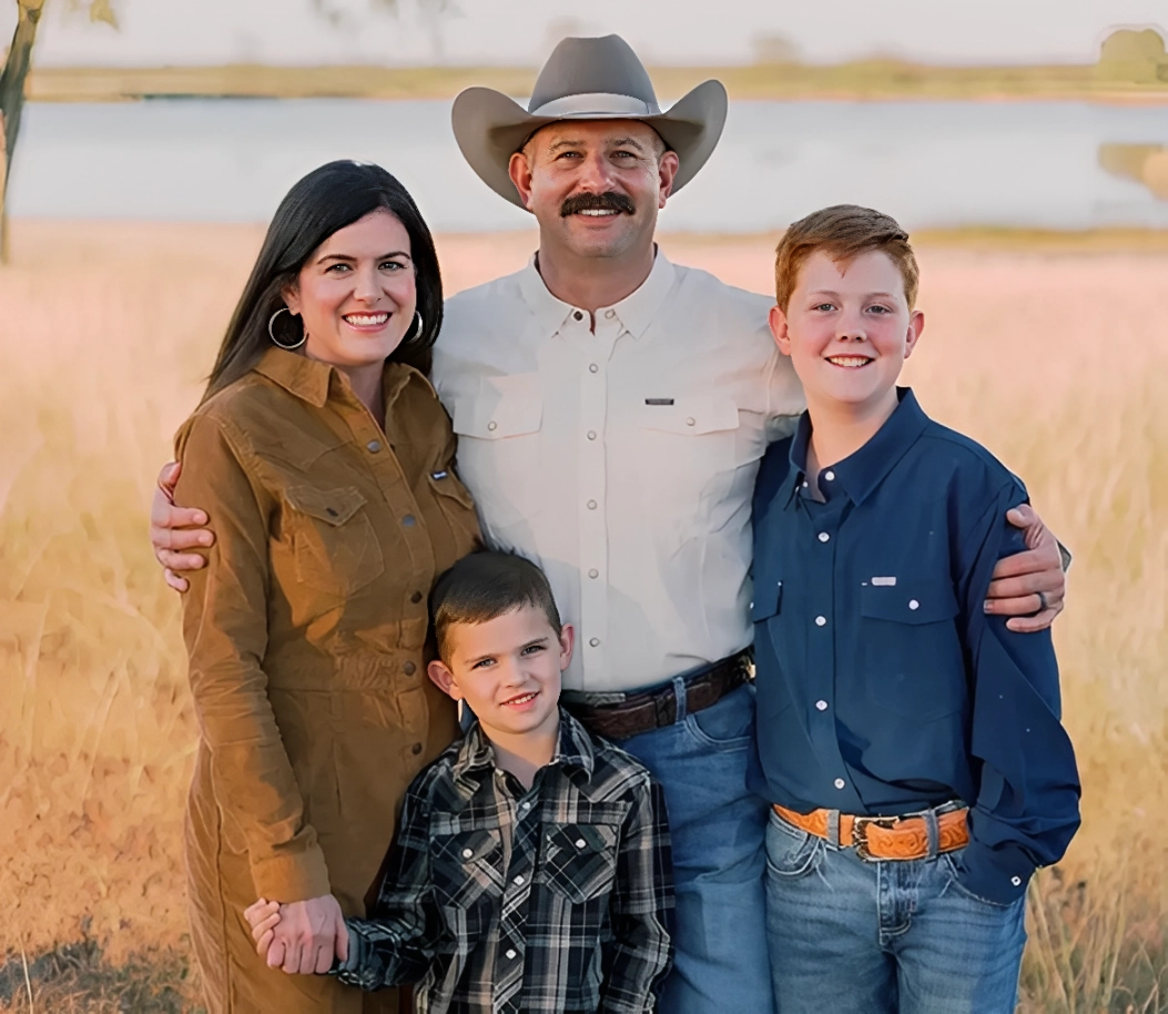 Family posing in a field